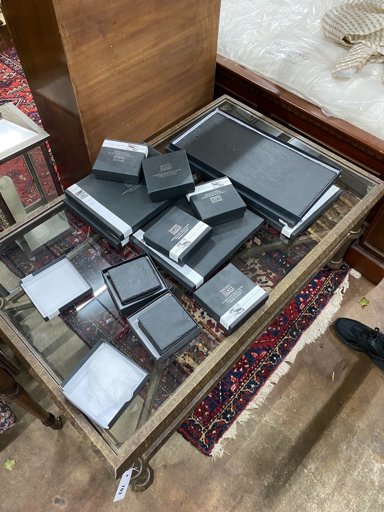 A quantity of 'The Just Slate Company' table mats, runners and coasters, all boxed
